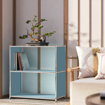 Modern metal bookcase with bonsai and books in Japanese-inspired minimalist living space
