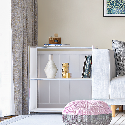 Modern metal bookcase styled in living room with books and decor
