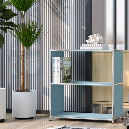 Modern metal bookcase styled with books and decor next to indoor plants in a bright contemporary living space
