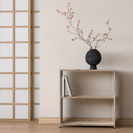 Minimal open bookcase with metal frame styled with vase and book in calm interior