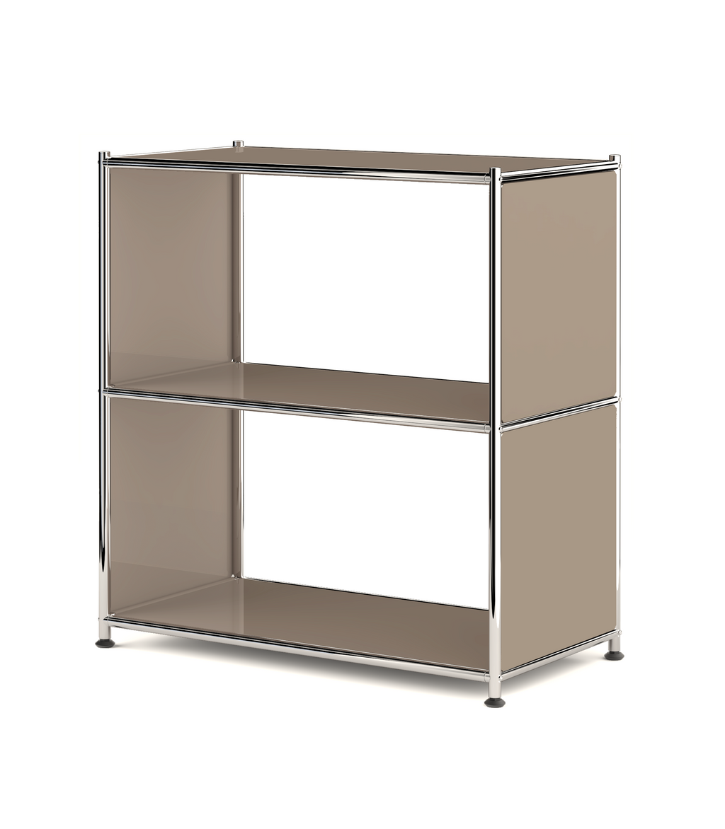 Metal bookcase with open shelves and chrome frame on white background