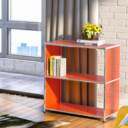 Orange metal bookcase near window with books and flower decor in modern living space
