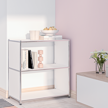 White metal bookcase with open shelves styled with books and decor in a pastel home interior
