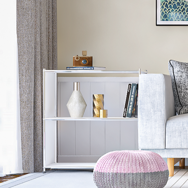 White metal bookcase with open shelves styled with books and decorative objects
